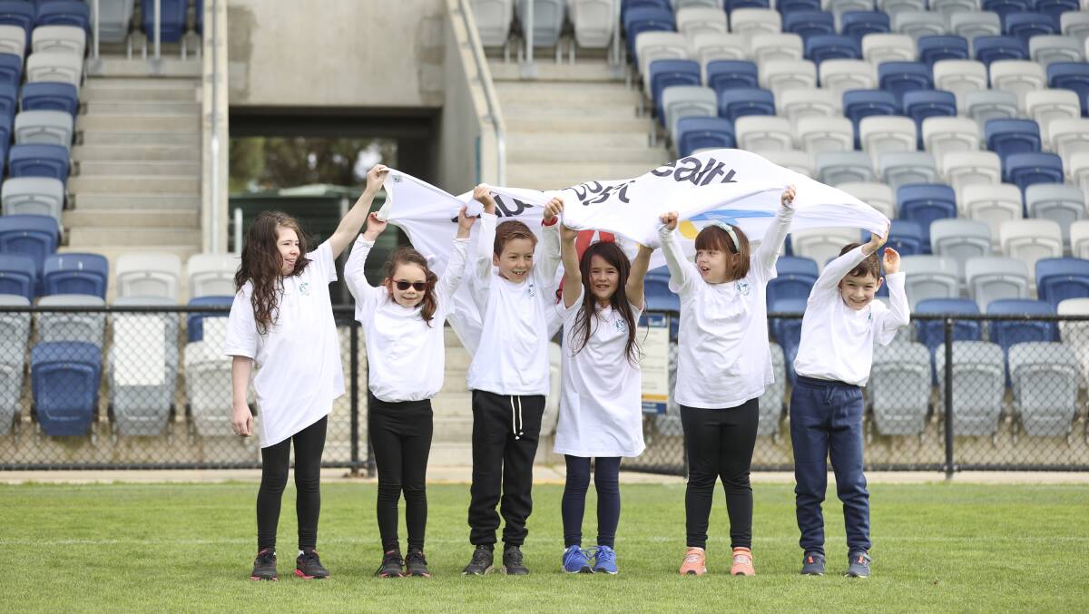 Youngsters celebrate the 2026 Commonwealth Games announcement for regional Victoria at Mars Stadium in April last year. Picture by Luke Hemer