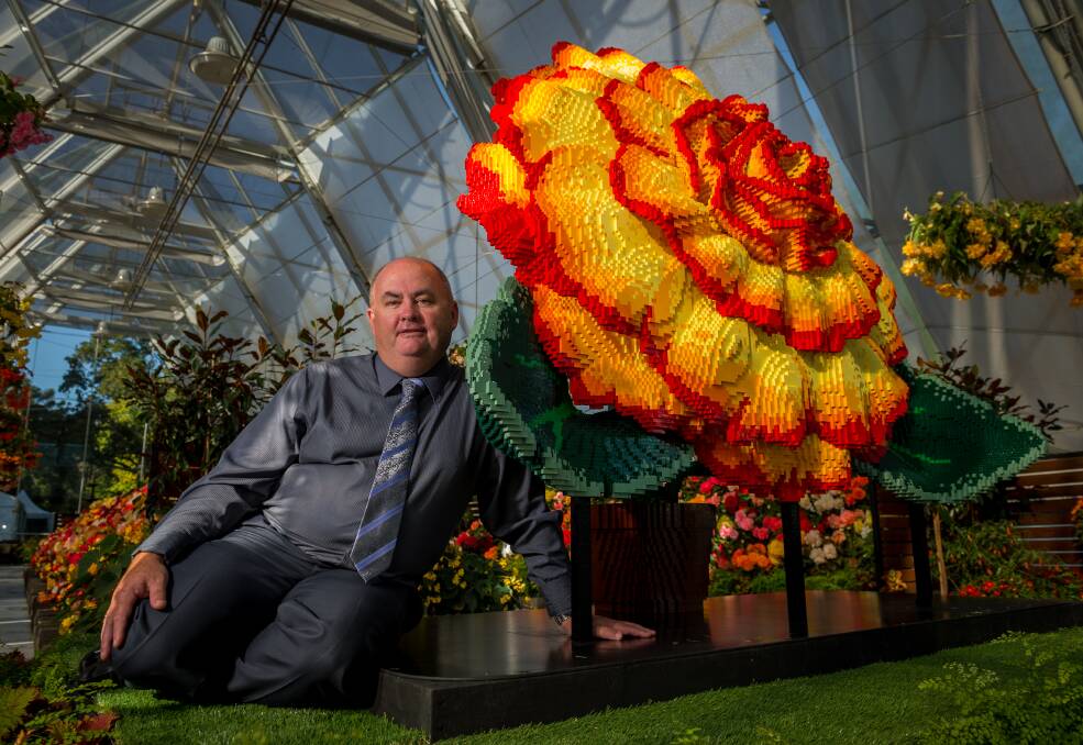 City of Ballarat councillor Des Hudson with the world's largest LEGO flower. Picture by Dylan Burns