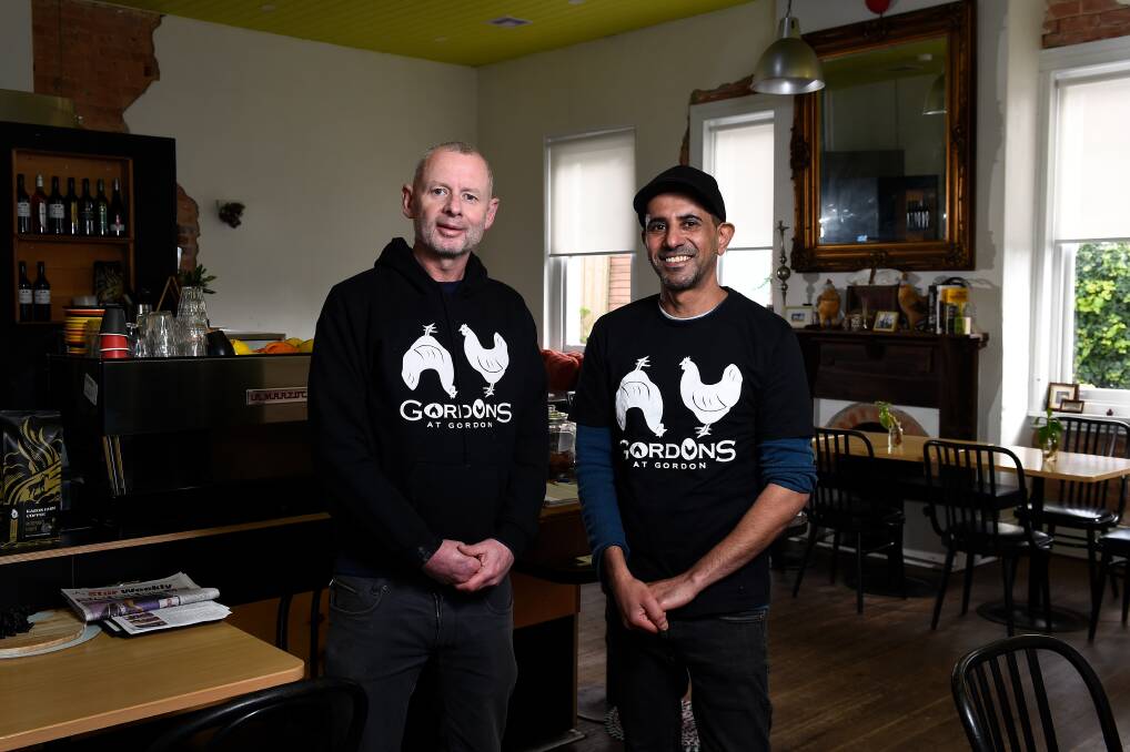 NEW LOOK: Gordons at Gordon cafe owners Saleh Alshamsi and Scott Graham embrace a bit of town history after being forced to adopt a new name. Picture: Adam Trafford