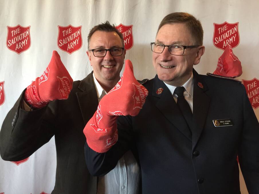 Radio Ballarat general manager John Fitzgibbon and Salvation Army Victorian State Commander, Lieutenant Colonel Bruce Stevens, sock out some sole-ful support to launch the annual Red Shield Appeal in Ballarat on Wednesday.