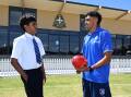 St Patrick's College boarder Joseph Wesley has a chat with Western Bulldog Arthur Jones after a special session with Indigenous students. Picture by Lachlan Bence