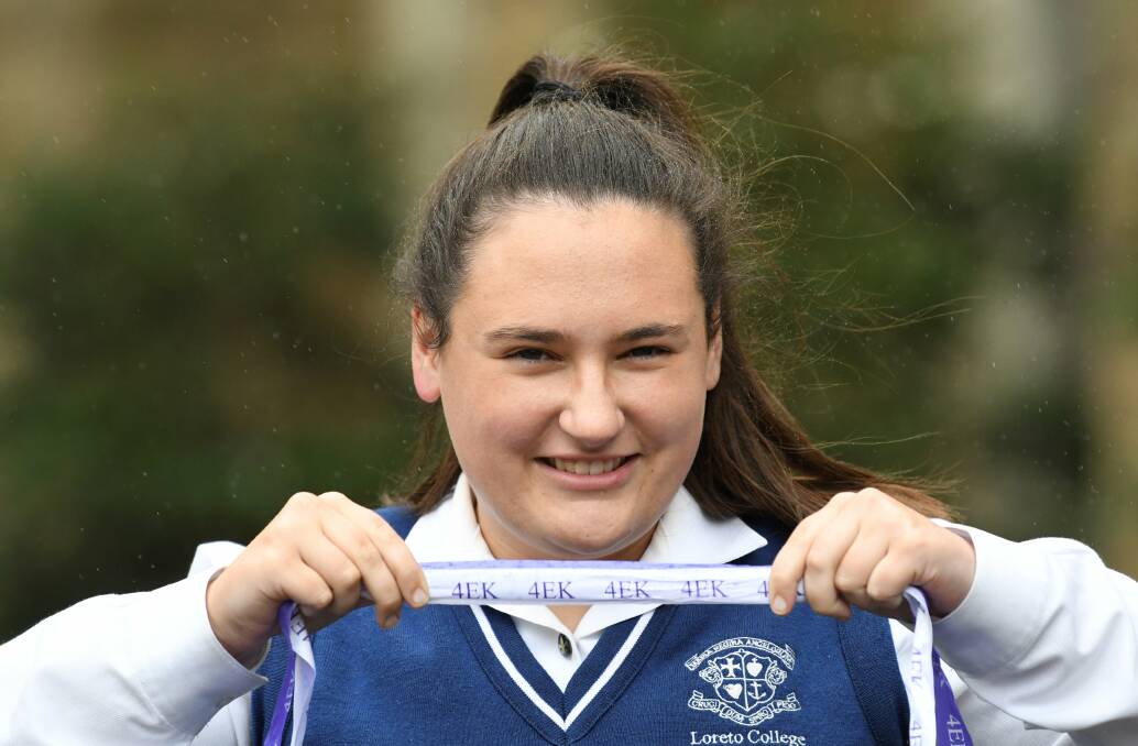 FOCUS: Loreto student Ellie Beaston sold more than 800 Run4EK ribbons for meningoccocal research in tribute to her friend Emma-Kate McGrath. Picture: Lachlan Bence