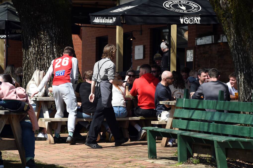 Busy scenes outside the Daylesford Hotel on Saturday amid an unexpected extra long weekend boost. Picture by Kate Healy.