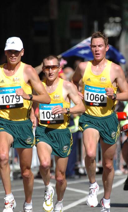 PROUD: Ballarat's Shane Nankervis, far right, runs in the green-and-gold along Flinders Street in the 2006 Melbourne Commonwealth Games. Picture: Lachlan Bence