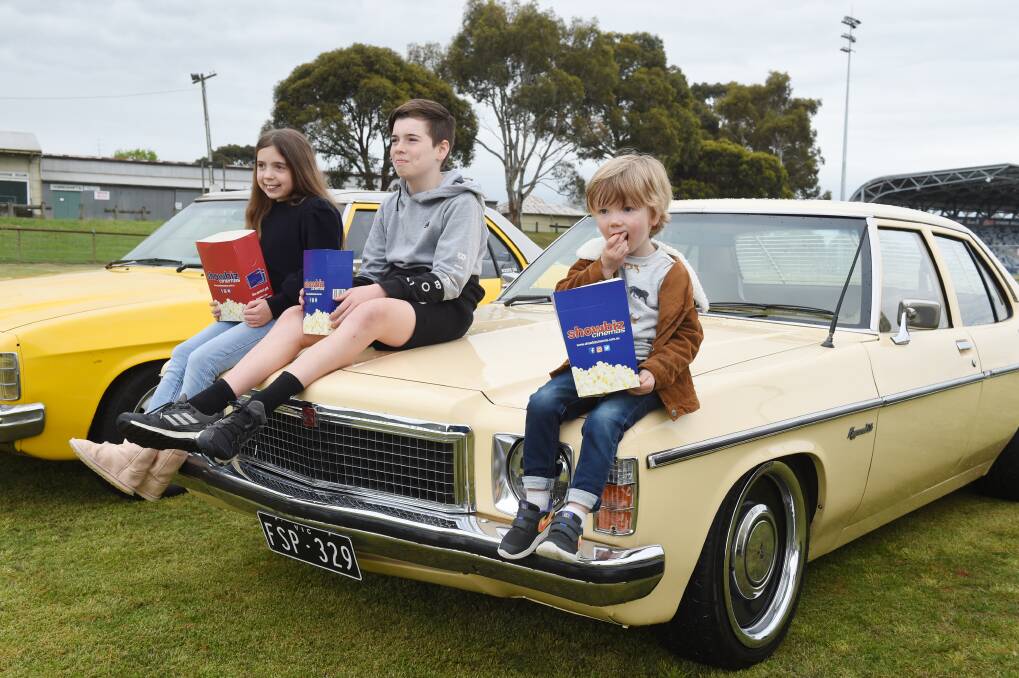 SET FOR ACTION: Ava, River and Felix prepare to experience what a drive-in cinema is all about. Picture: Kate Healy