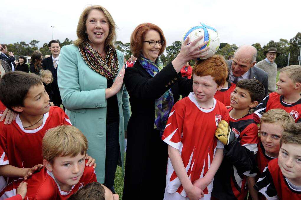 Ballarat federal MP Catherine King and Prime Minister Julia Gillard visit junior soccer players at Morshead Park in 2013. 