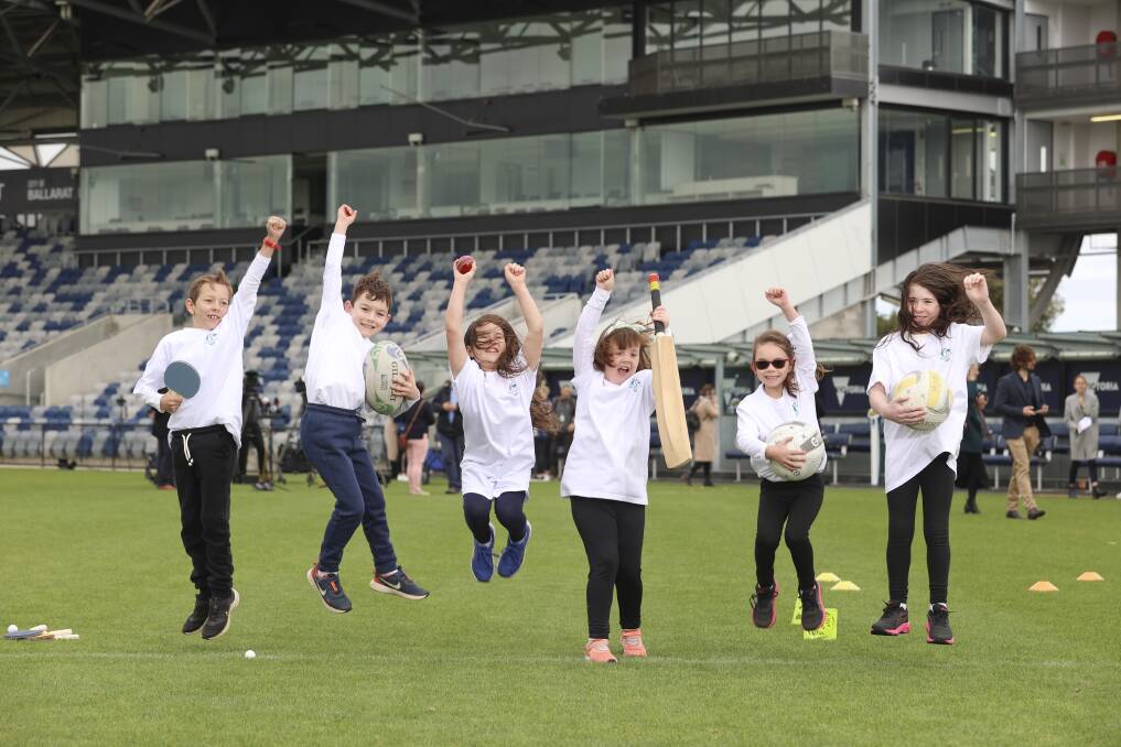 CELEBRATE: Junior sports fans get into the Commonwealth Games action at Mars Stadium on Tuesday. Picture: Luke Hemer