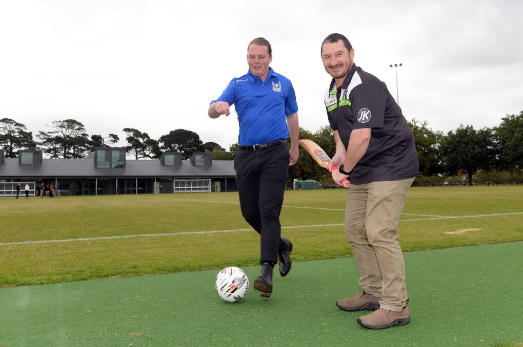 Victoria Park Football Club president Will Cousens and Lucas Cricket Club president Dave Horwood get straight to business on their newly opened home ground. Picture by Kate Healy