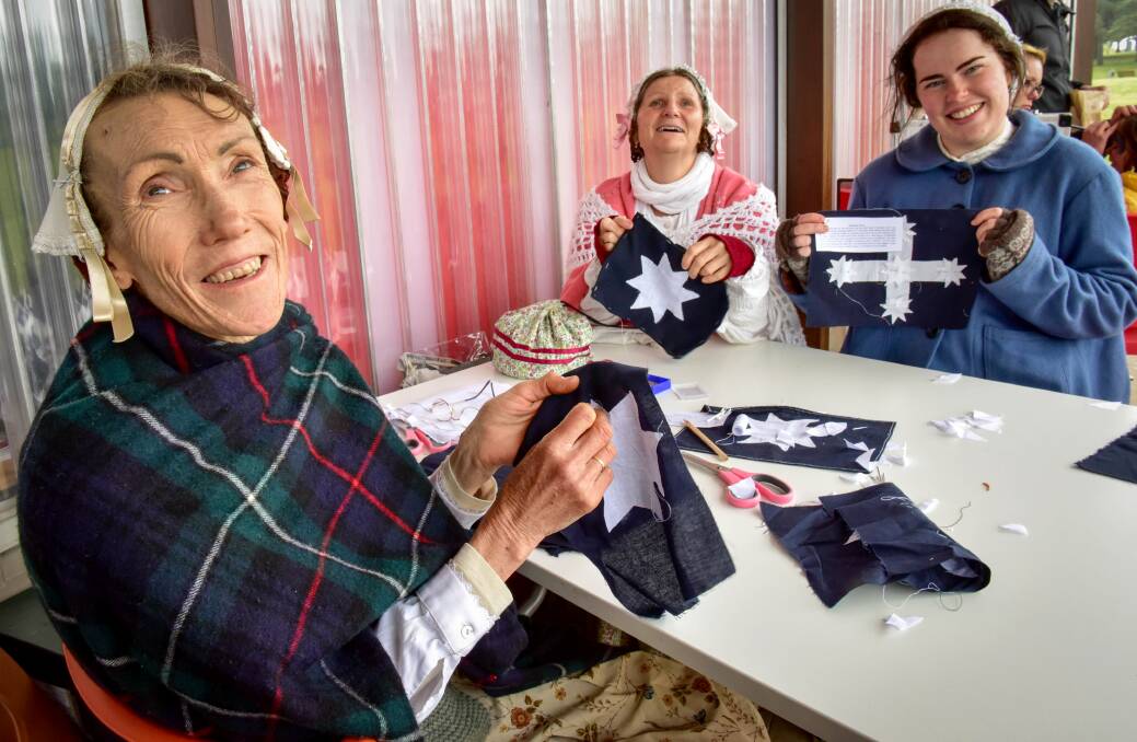 FLASHBACK: Karen Royce, Christina Sandler and Tess Shacklock get sewing in the spirit of the three women who made the Eureka Flag on the Goldfields. Picture: Brendan McCarthy