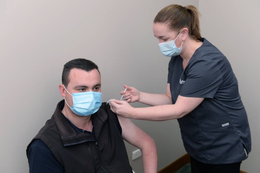 ROLL-UP: Matt Green receives his jab from registered nurse Trish Libbis at UFS' COVID-19 vaccination centre last month. Picture: Kate Healy