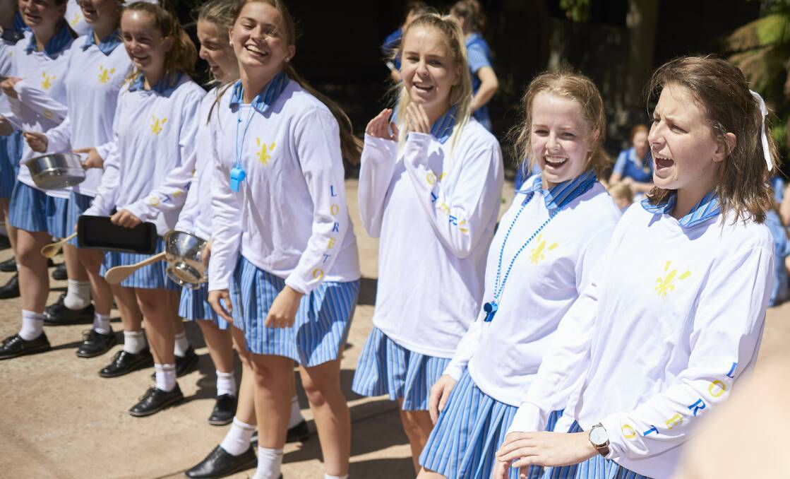 FULL VOICE: Loreto College's spit crew rallies the student body in the quad at lunchtime on Friday to ensure their cheer presence is felt at Boat Race on Sunday. Picture: Luka Kauzlaric