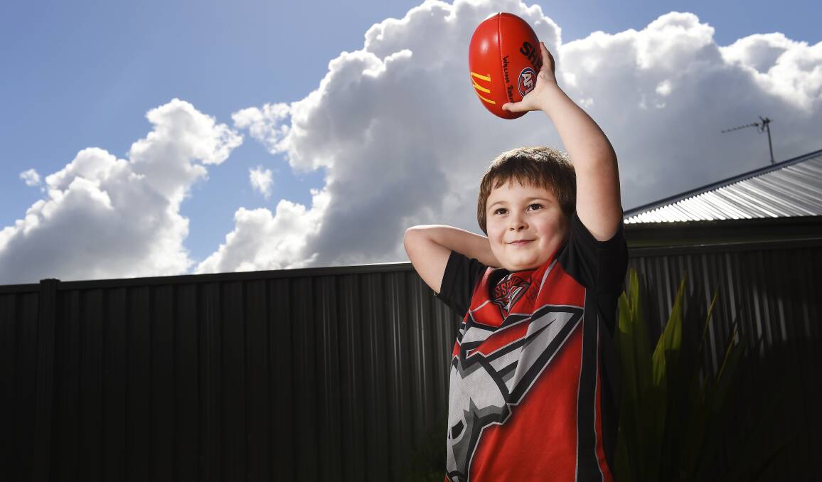 STAR STRUCK: Six-year-old Bomber fan Will Robinson's new favourite player is Western Bulldog Jack Macrae because Macrae was nice to him. Picture: Luka Kauzlaric