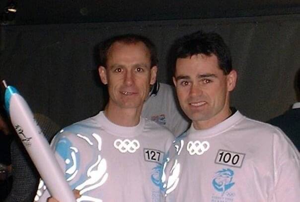 FIRED UP: Steve Moneghetti and Stephen McMahon catch up in Ballart's Olympic torch relay.