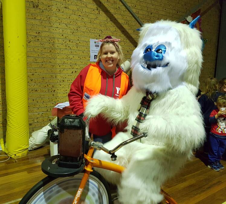 WARMING UP: Yumble the Yeti is ready to get to work again on the smoothie bike at the YMCA WinterFest Market on Friday night.