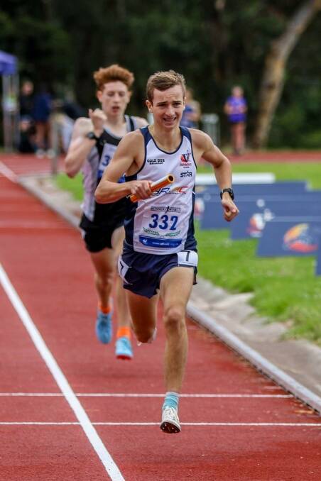 EFFORT: Isaac Rossato runs the 800m leg to take line honours in the men's under-18 medley relay.