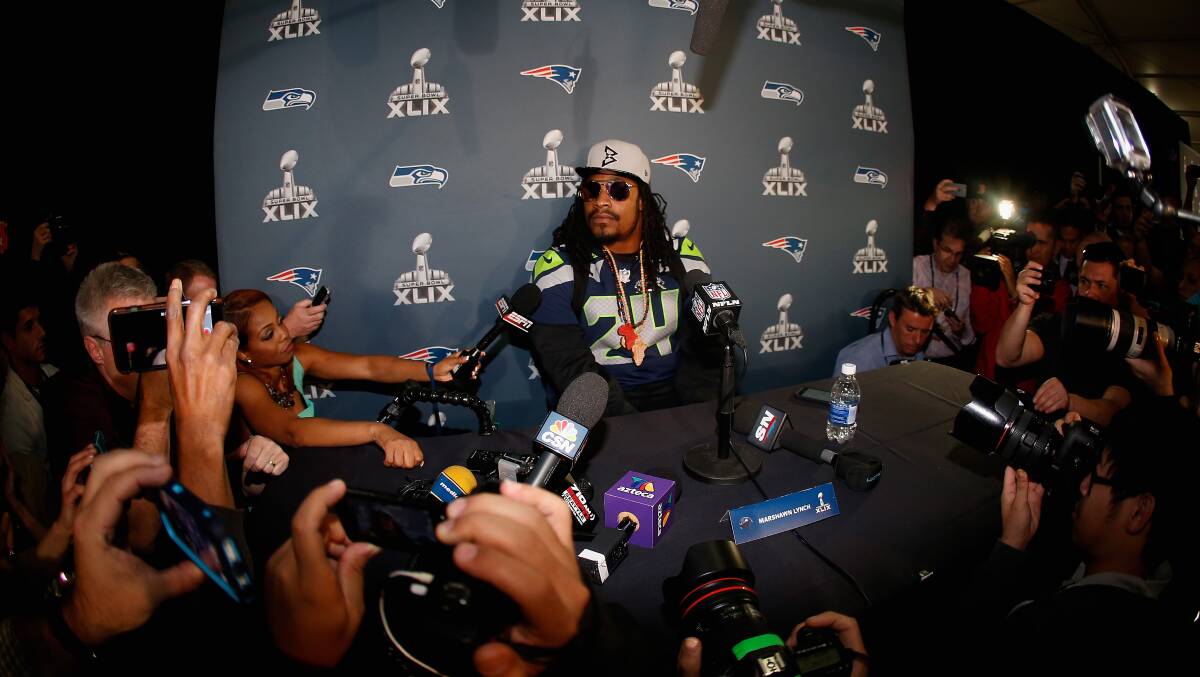 BEAST MODE: Then-Seahawk Marshawn Lynch meets the NFL's mandatory open media access by answering "I'm just here so I won't get fined". Picture: Getty Images