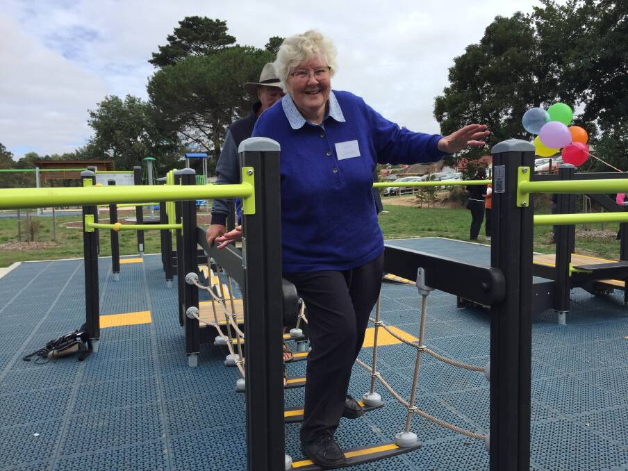 BALANCING ACT: Miners Rest's Claire Dalman tests her footing on a challenging bridge walk at the new Mount Pleasant seniors exercise space. 