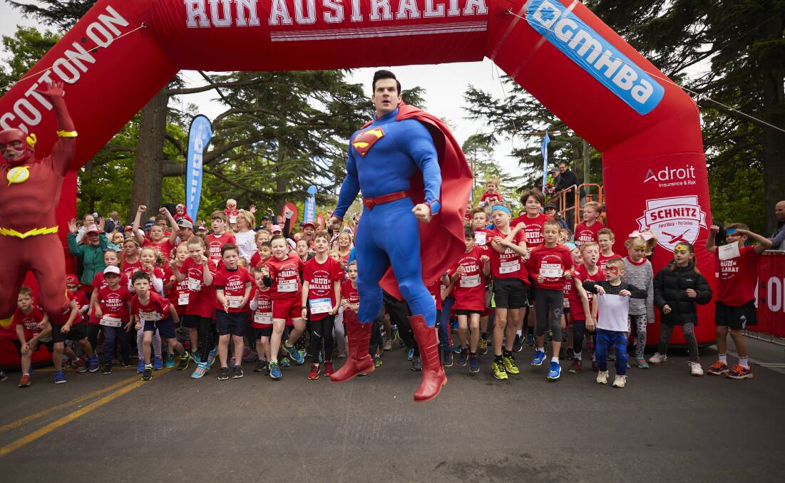 Superman helps launch a super power children's run last year. Picture: Luka Kauzlaric