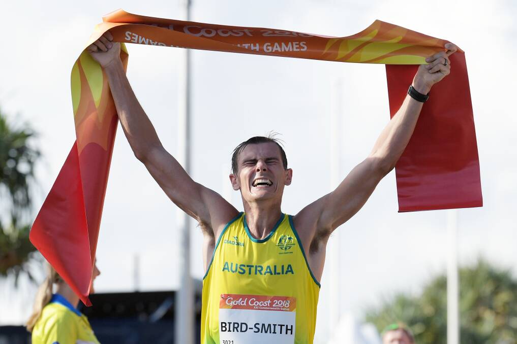 Dane Bird-Smith crosses the line to win gold in the men's 20-kilometre walk in the Gold Coast Commonwealth Games. Picture: AAP