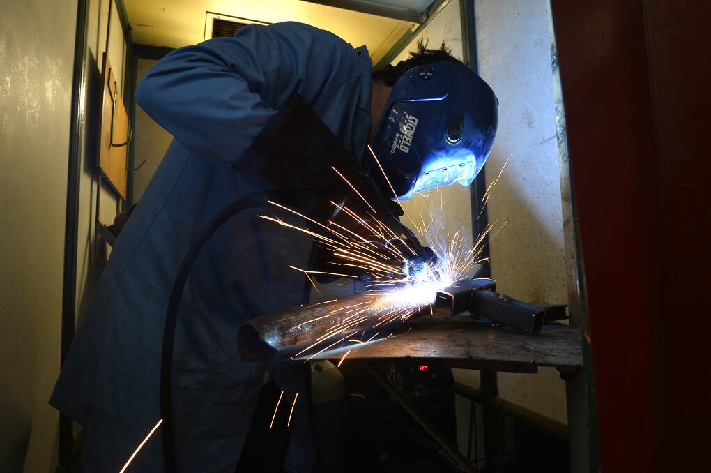IGNITING LEARNING: A VCAL student in Daylesford gets to work welding. Picture: Dylan Burns.