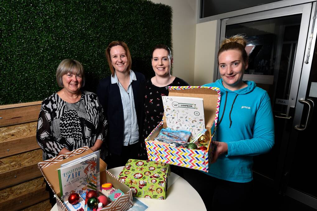 PACKING TEAM: YMCA Ballarat's Gayle Govan, Kate Fellowes, Carly Bruhn and Sara Salicki are ready to assemble donated gifts for teenagers in the annual Boxes of joy campaign. Picture: Adam Trafford