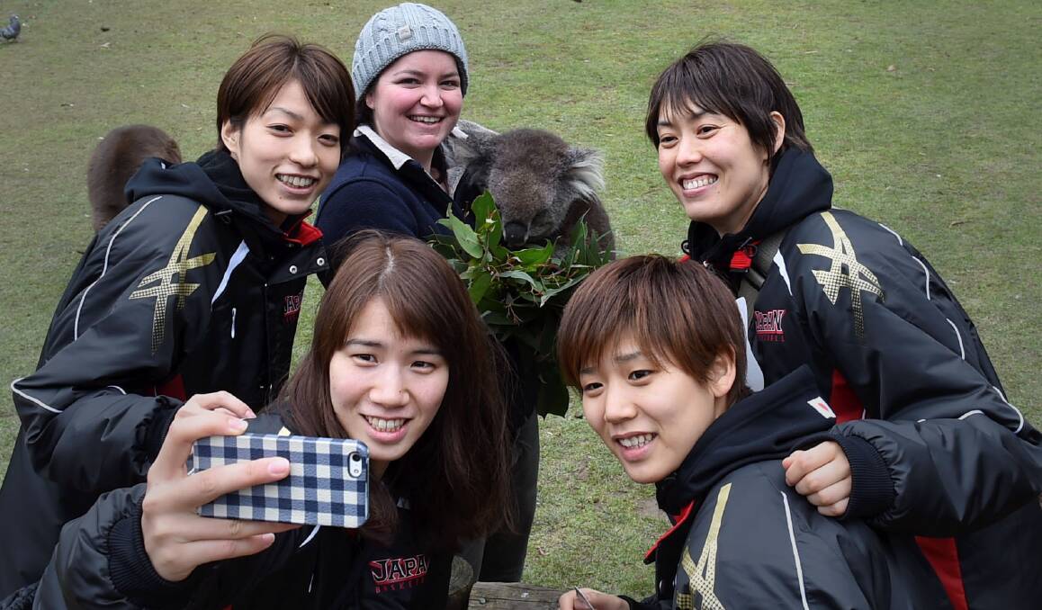 TIME OUT: Chinatsu Yamamoto Mio Shinozaki, Ai Mttahi, Rui Machida take a selfie with Milton and Shanna Love. Picture: Lachlan Bence