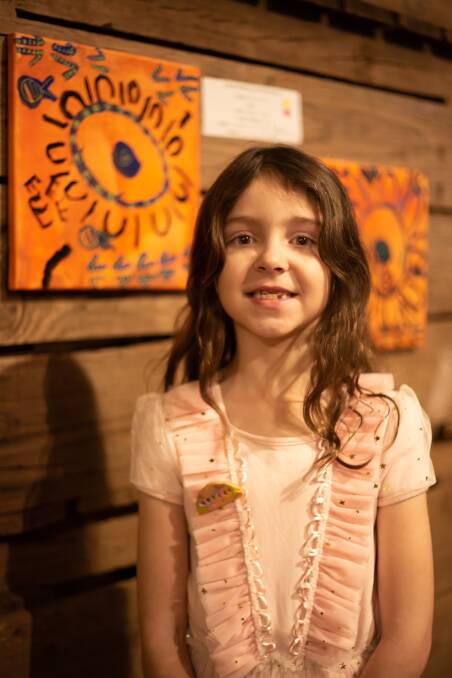 PROUD: Young Indigenous artist Macy at Ballarat and District Aboriginal Cooperative's youth art exhibition this week. Picture: Rachael Green