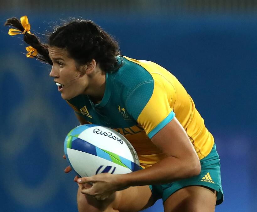 HEROIC: Pearl Charlotte Caslick has fast become a popular, new-look sporting role model for her strength, tenacity and crunching tackles in Australian women's rugby sevens. Picture: Getty Images