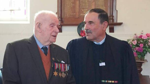 Ambulance field corporal George Prolongeau with Baptist minister Keith Lanyon, an Air Force chaplain at an Anzac Day service two years ago.
