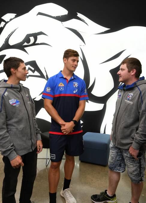 ROLE MODELS: Western Bulldog Josh Dunkley catches up with Ballarat Sons of the West members Anderw Ottini and Dwayne Smith. Picture: Lachlan Bence