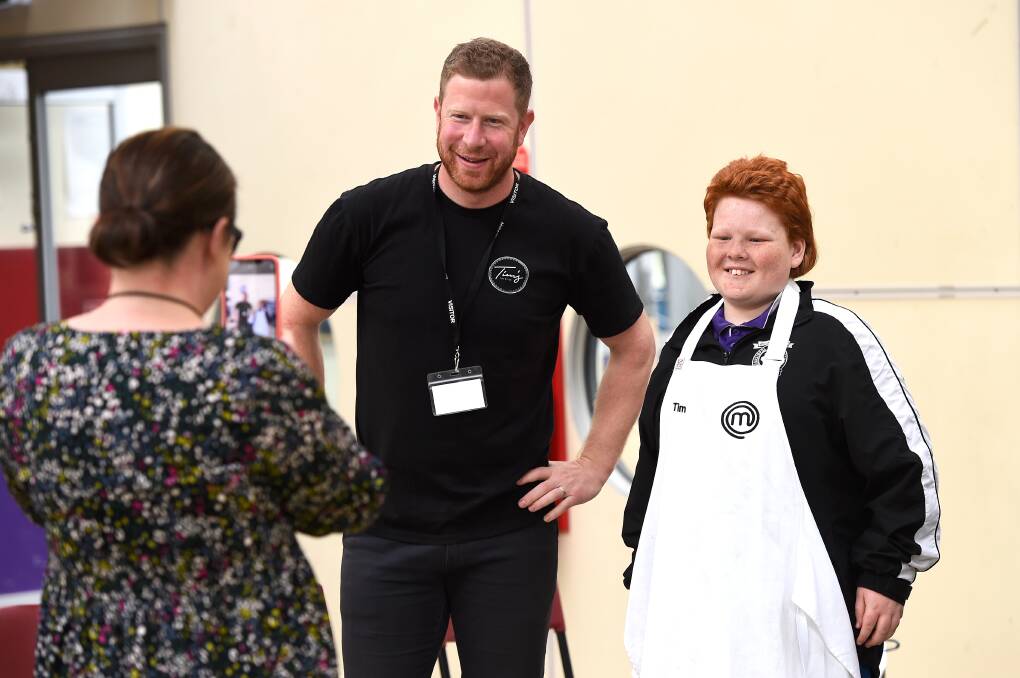 POTENTIAL: MasterChef Tim Bone lets Sebastopol pupil Boyd try on his apron in the careers session. Picture: Adam Trafford