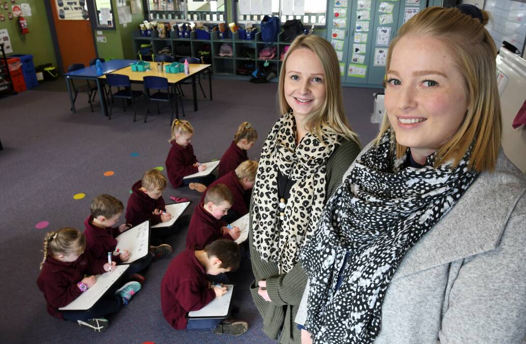 LESSON: Mount Blowhard teachers Zoe Bilton and Kelsie George say their pupils' literacy skills are flying with explicit teaching. Picture: Lachlan Bence