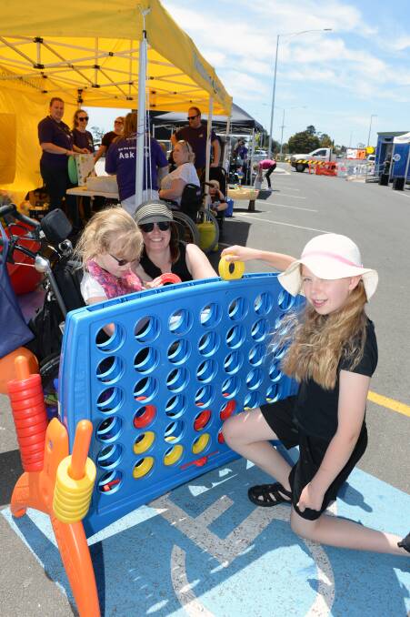 WELCOME: Community disability advocate Rebecca Paton with daughters Sarah, age 12, and Hannah, age 11, test their skills together on Saturday. Picture: Kate Healy