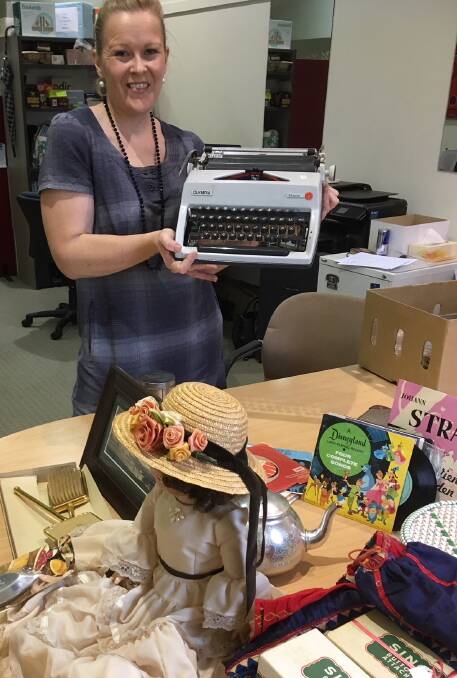 Ballarat Hospice Care Op Shop manager Heidi O’Neill with some of the vintage items including an old typewriter.