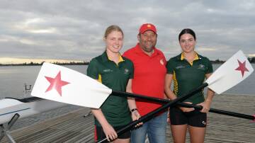 Rowing coach Jamie McDonald with Lucy Richardson and Katie Jackson on the deck ahead of their World Under-19 Rowing Championship venture. Picture by Kate Healy