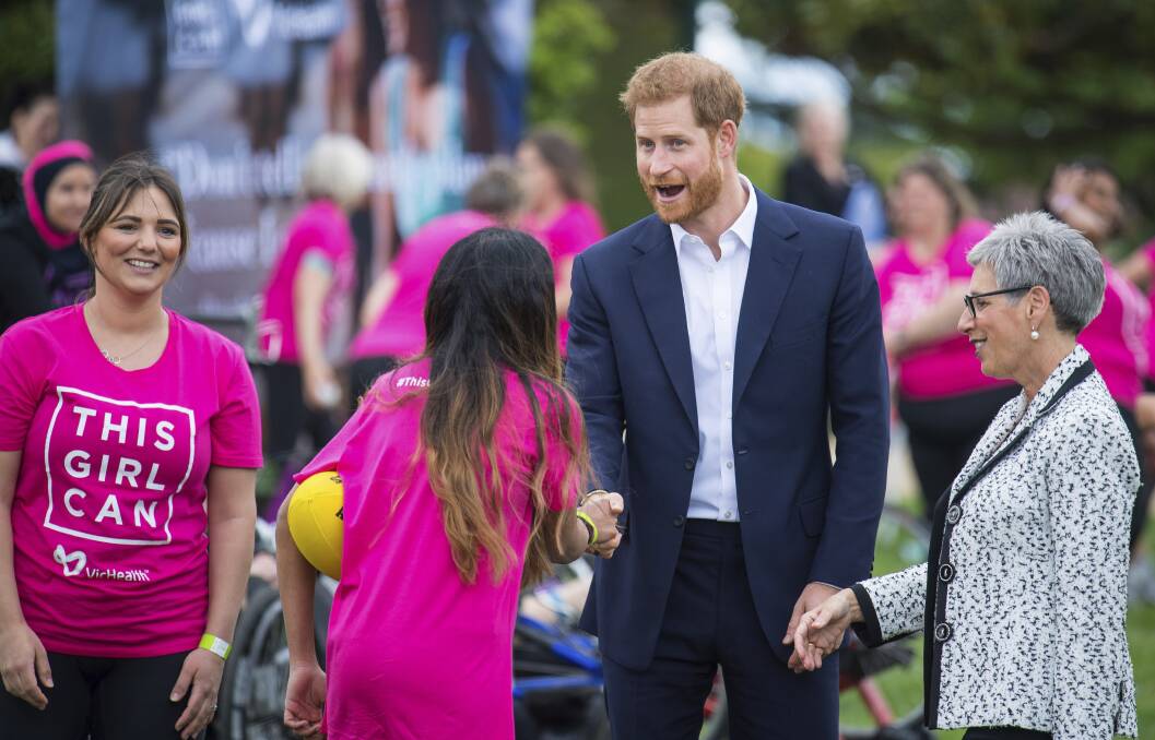 FUN: Prince Harry meets with participants from VicHealth's This Girl Can programs in his visit to Melbourne in October. The showcase featured Ballarat Daughters of the West participants. Picture: AP
