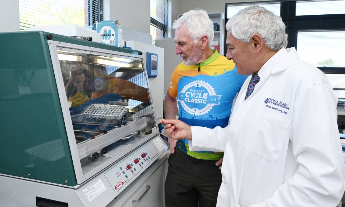 AFL great Michael Malthouse takes a close-up look in the FECRI laboratory with FECRI honourary director Professor George Kannourakis on February 1, 2024. Picture by Kate Healy