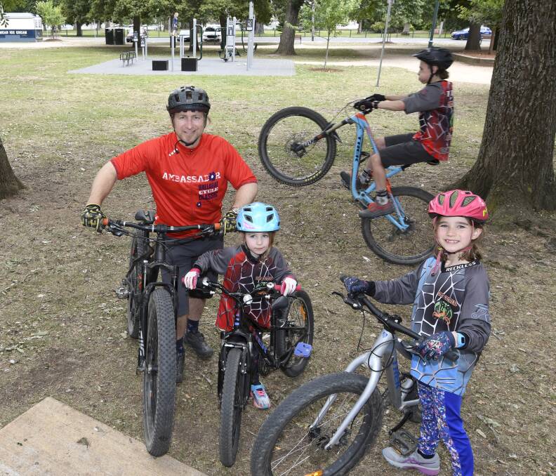 WARMING UP: Ballarat Cycle Classic mountain bike ambassador Antanas Spokevicius with five-year-old Tamas, eight-year-old Ahna and 11-year-old Klara who are ready for a family adventure. Picture: Lachlan Bence