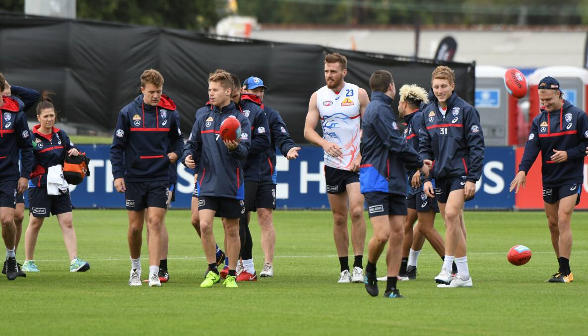 PREPARATION: Western Bulldogs players, including Ballarat export Jordan Roughead in white, test the Mars surface on Friday morning. Picture: Lachlan Bence
