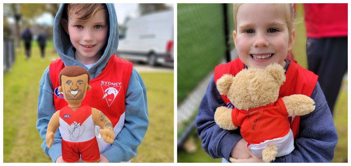 HAPPY CYGNETS: More than a year after Edwin and Mia hoped to meet Buddy Franklin in Ballarat, they had the chance to catch him at a training session in Melbourne. Pictures: Matthew Bruty