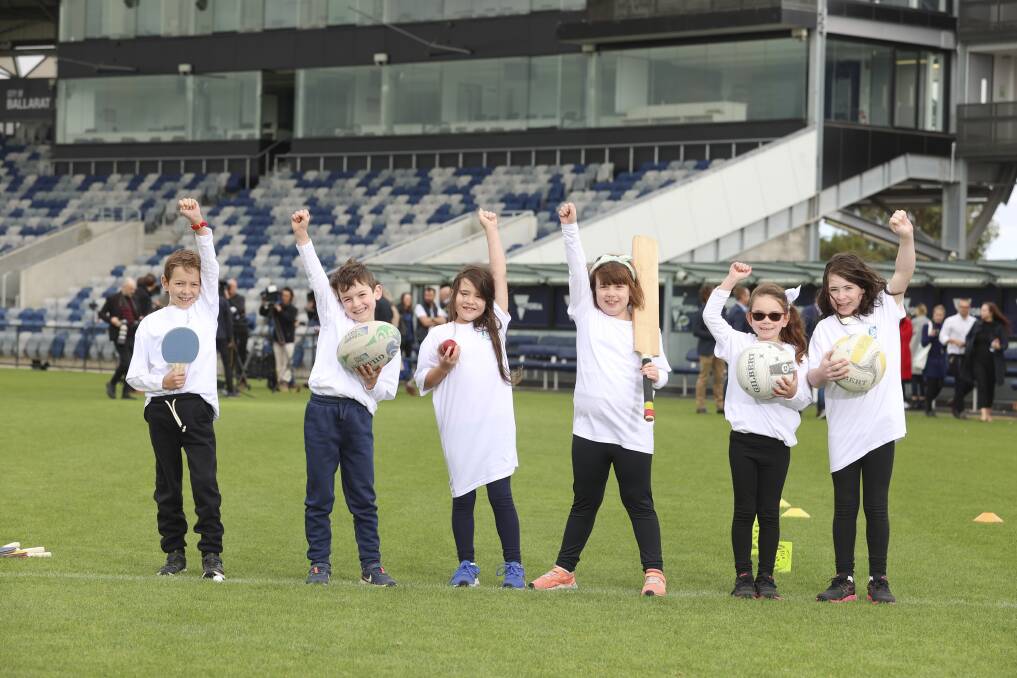 FUTURE: Children celebrate the Commonwealth Games announcement in April on Mars Stadium, a football field set to transform for world-class athletics. Picture: Luke Hemer