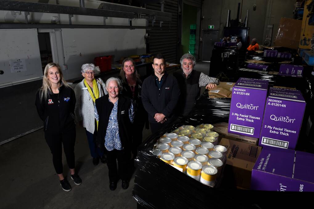 SUPPORT: Radio Ballarat's Kirsten Slater, St Vincent de Paul's Sue Calistro, Anglicare's Kim Boyd, Uniting Ballarat's Tania Jennings, Blake Family Grocers' Andrew Pocock and Salvation Army's John Clonan unite in facing increasing demand for food relief. Picture: Adam Trafford