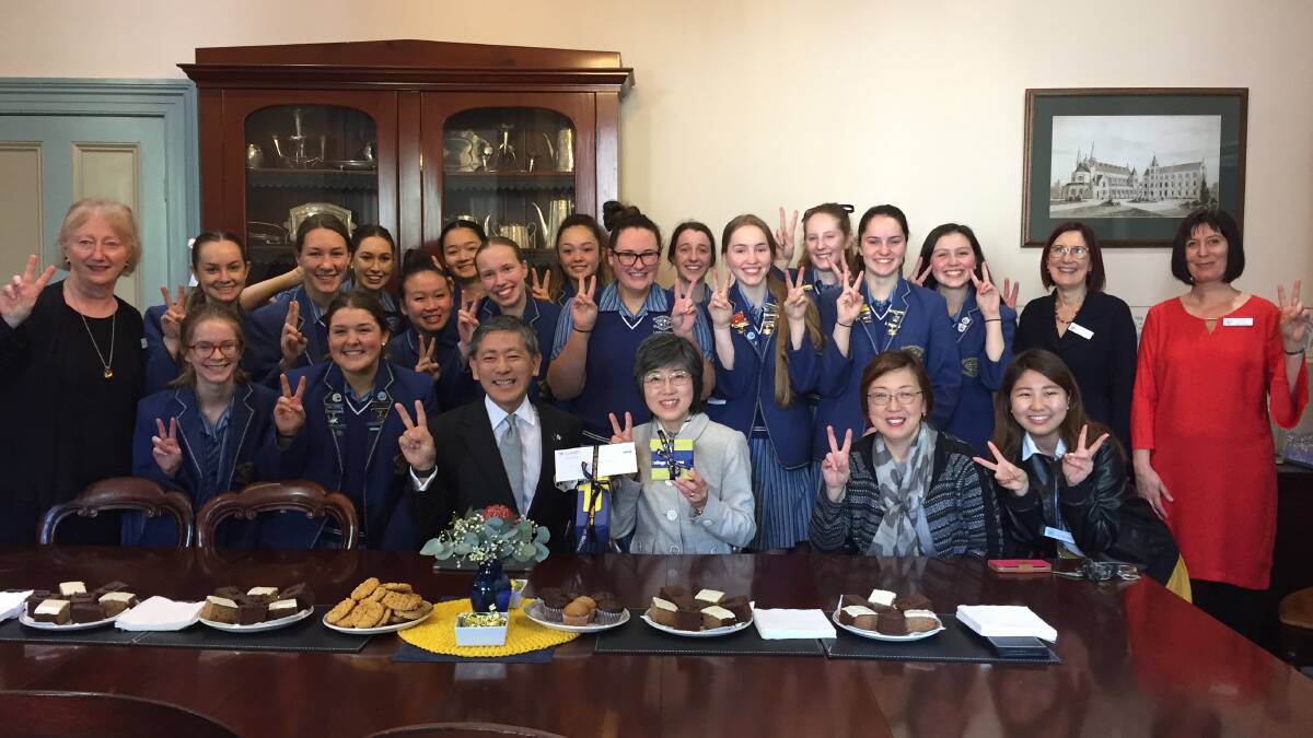 KONNICHIWA: Consul-General Kazuyoshi Matsunaga has morning tea in the parlour with Loreto College year 12 Japanese language students.
