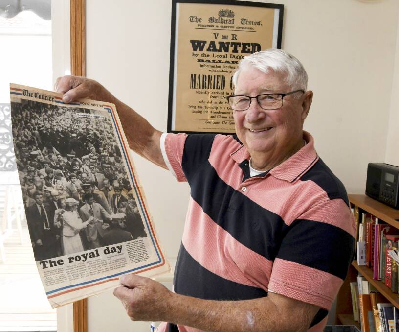 Forty years on, Peter Gilbert with a copy of his Wanted poster and a lift-out from The Courier commemorating the young royal couple's visit to Ballarat. Picture by Lachlan Bence