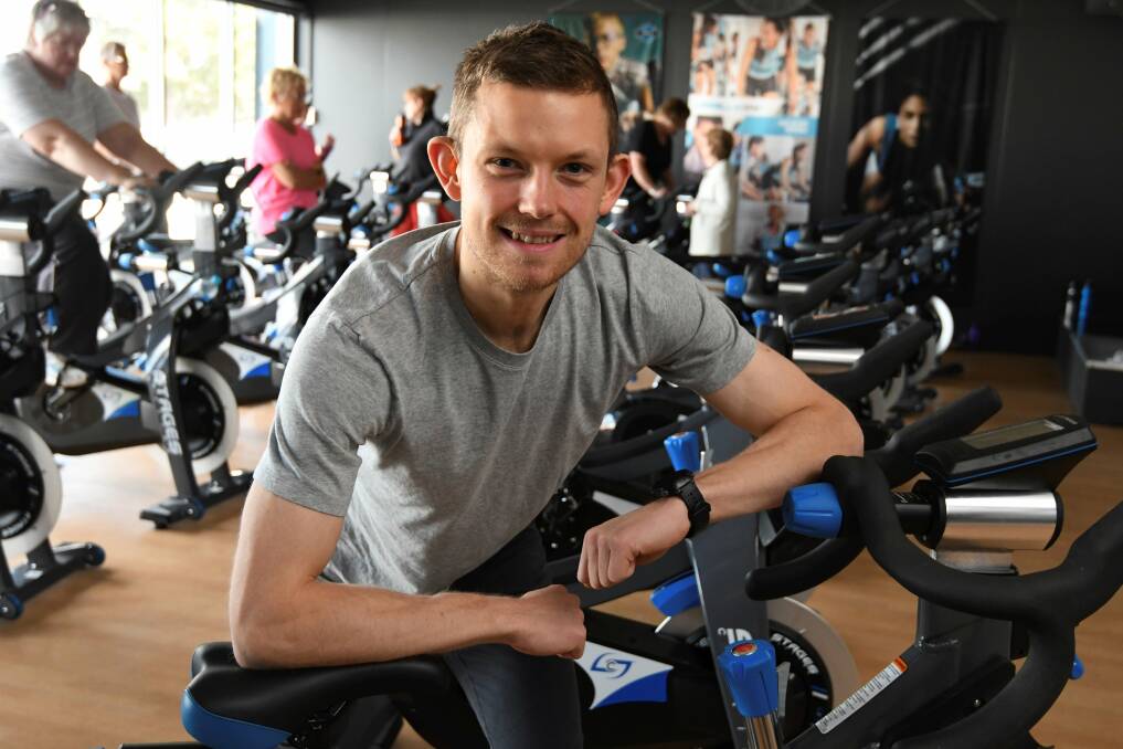 IN A SPIN: Gym-goer Alistair Cardew urges other Ballarat men to try a group session, like boxing or on the bikes, to take the next step on their health, fitness journeys. Picture: Lachlan Bence