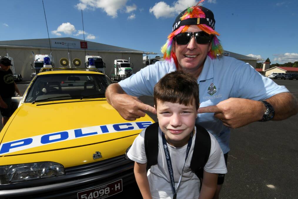 ALERT: Nine-year-old Oscar with Ballarat Highway Patrol's Craig Walker at Cops 'N' Kids last year. Picture: Lachlan Bence