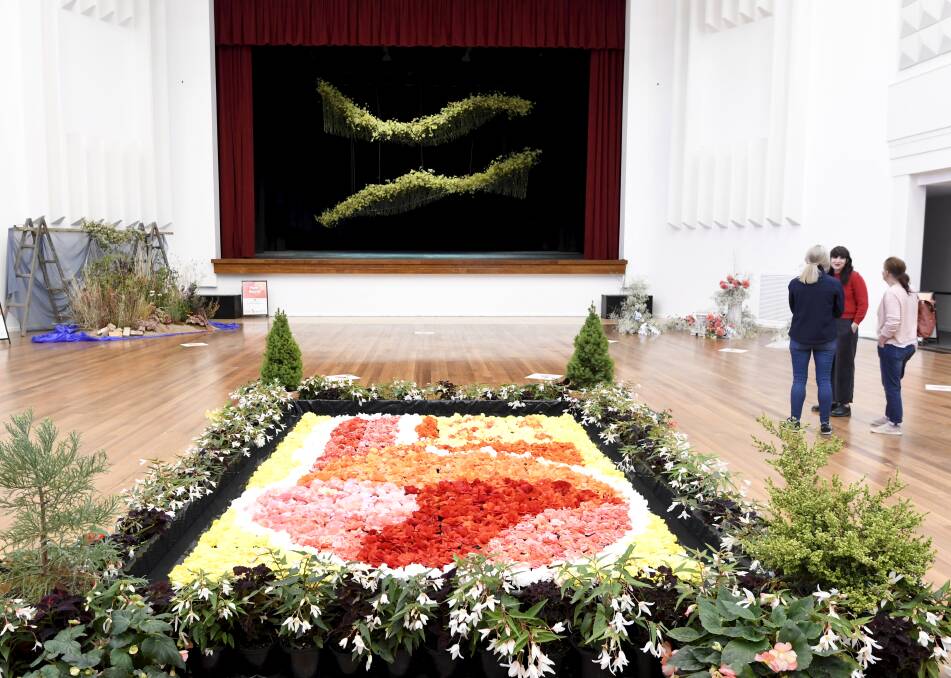 URBAN FIND: A floating floral carpet and illuminated display inside Civic Hall remains in place next weekend. Picture: Lachlan Bence