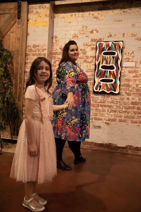 BRIGHT NOTES: Macy and Jane Marini explore Ballarat and District Aboriginal Cooperative's youth art exhibition this week. Picture: Rachael Green