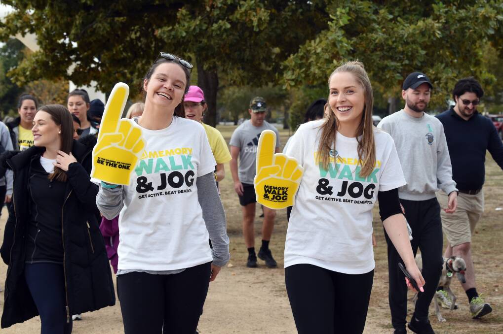 WALKING EXAMPLE: Young dementia advocate Meg Curnow and Brittany Rose lead a do-it-yourself memory walk last year. Picture: Kate Healy