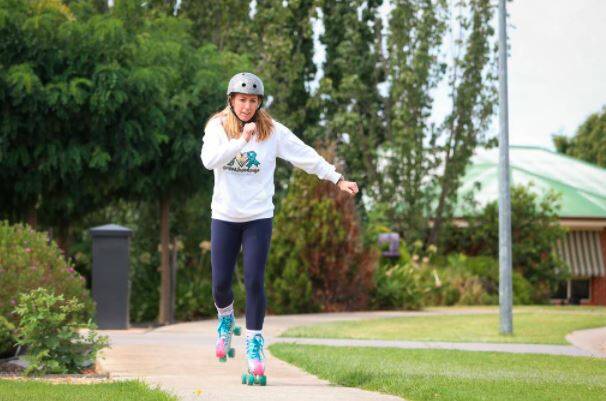 NEW SKILLS: Treahna Herbertson trains at home in Wodonga, putting on roller skates for the first time since her childhood. Picture: The Border Mail